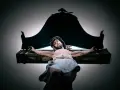 A statue of Jesus on the cross, with a dark canopy above. This image evokes the sacrifice and the question of why Jesus died.