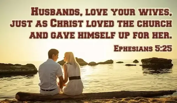 A couple sits by the sea, embodying the biblical definition of love as husbands love their wives as Christ loved the church. Ephesians 5:25.